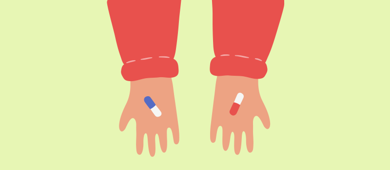 cartoon hands, one holding. a blue and white pill, while the other is holding a red and white pill