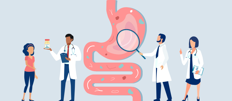 cartoon wiith doctors examining stomach and digestive tract