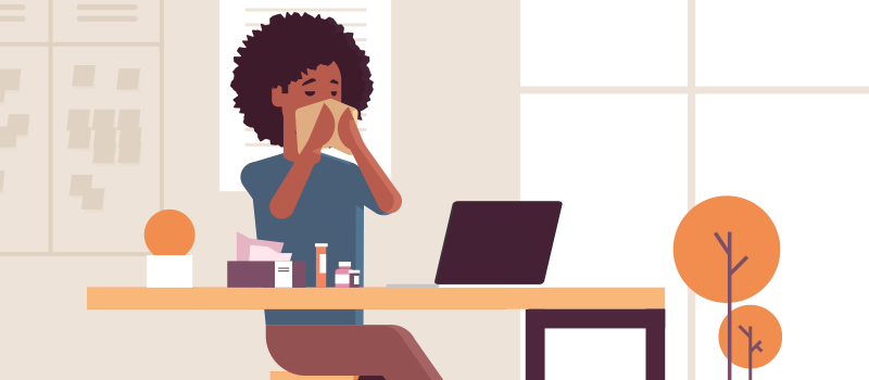 cartoon woman with allergies blowing nose at desk